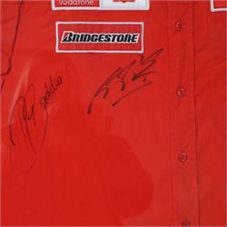 Scuderia Ferrari 2004 shirt, bearing four signatures including Michael Schumacher and Rubens Barrichello, to commemorate five consecutive World Championship wins, in glazed frame, frame H85cm
