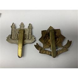 Twenty cap badges including Hertfordshire, Royal Sussex, Cambridgeshire, Hampshire, Notts and Derby, East Surrey, Herefordshire, South Lancashire, Devonshire, Bedfordshire, Durham Light Infantry etc (20)