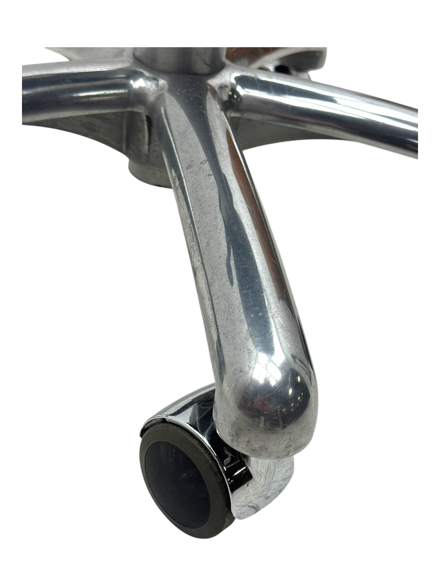 Score - contemporary 'Amazone' saddle stool, upholstered in black leatherette with adjustable height and tilt mechanism, raised on chrome spoke base fitted with castors