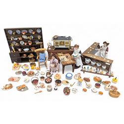 Victorian and later style dolls house kitchen furniture, including countertop, dresser displaying copper pots and blue and white ceramics, baking table, oven, three figures and a collection of food and baking accessories