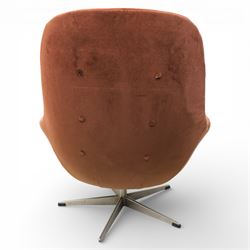 Pair of mid 20th century brown velvet swivel lounge chairs and matching footstool, the shaped and padded back with buttoned segmented cushion over conforming seat cushion, flared armrests and moulded sides, raised on a five point metal swivel base, the footstool en suite with buttoned cushion and matching metal base
