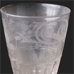 Early 19th century glass rummer, the deep bucket shaped bowl engraved with an oval roundel containing initials BC flanked by flowers of the Union, and a carriage drawn by four horses, above cut fluted and vertical cut bands, upon a short diamond cut knop stem, and square base, H15cm