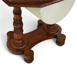William IV mahogany work table, the octagonal top with ebony line inlay and dentil moulded edge, fitted with four small drawers to the frieze, above a silk-pleated sliding work basket, all raised on a turned column supports and shaped platform base with rounded feet, circa 1835