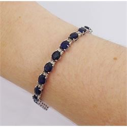 18ct white gold oval cut sapphire and round brilliant cut diamond bracelet, total sapphire weight approx 12.00 carat