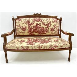 French style walnut framed two seat settee, shaped cresting rail, acanthus carved arms, turned tapering fluted supports, upholstered in a toile de jouy fabric