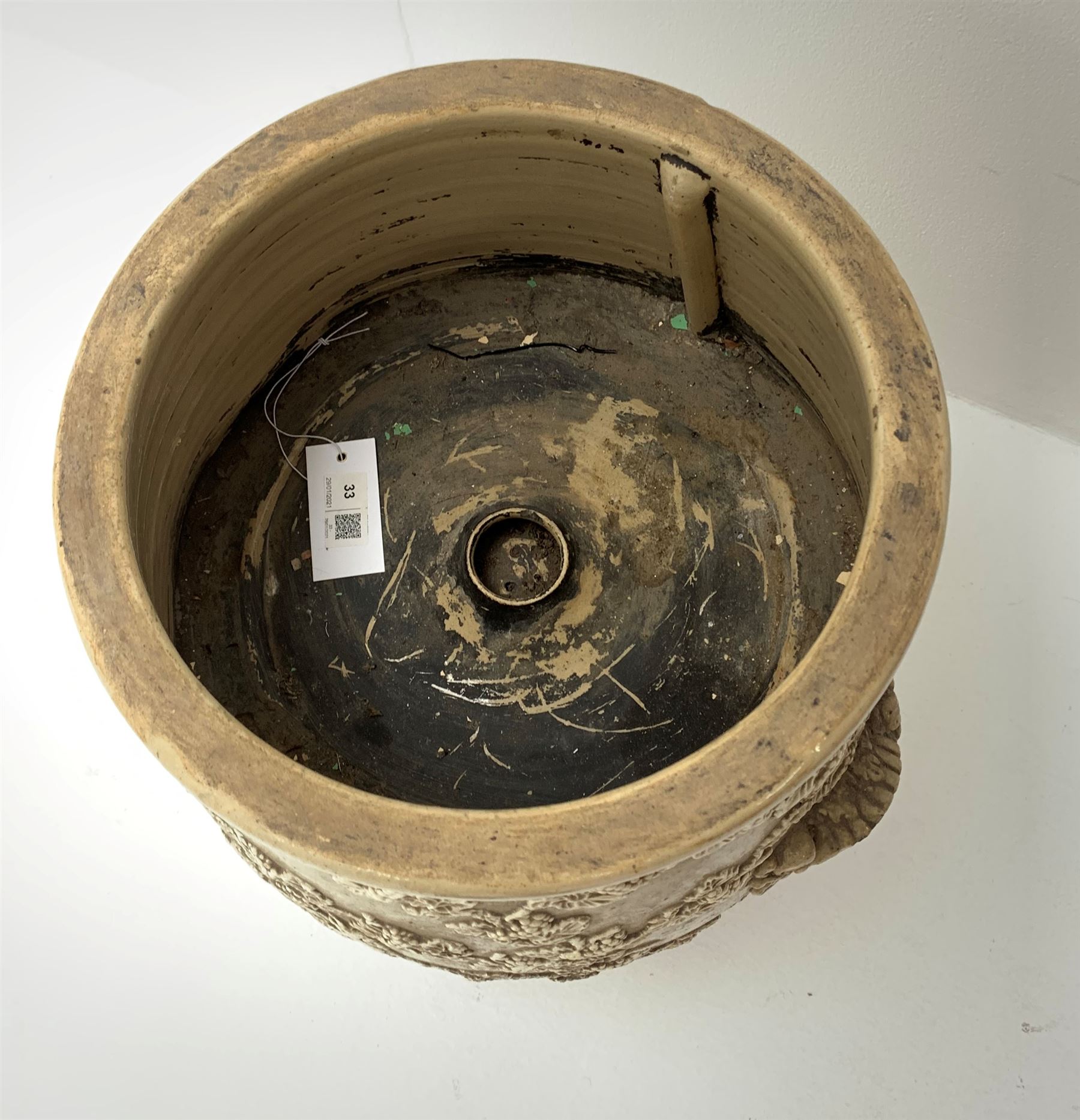 A Victorian Lipscombe & Co stoneware water filter, the body with twin scrolled lug handles, and applied fruiting vine decoration to the front, with applied maker's plaque detailed Lipscombe & Co Patentees 233 Strand Temple Bar London, H54cm. 