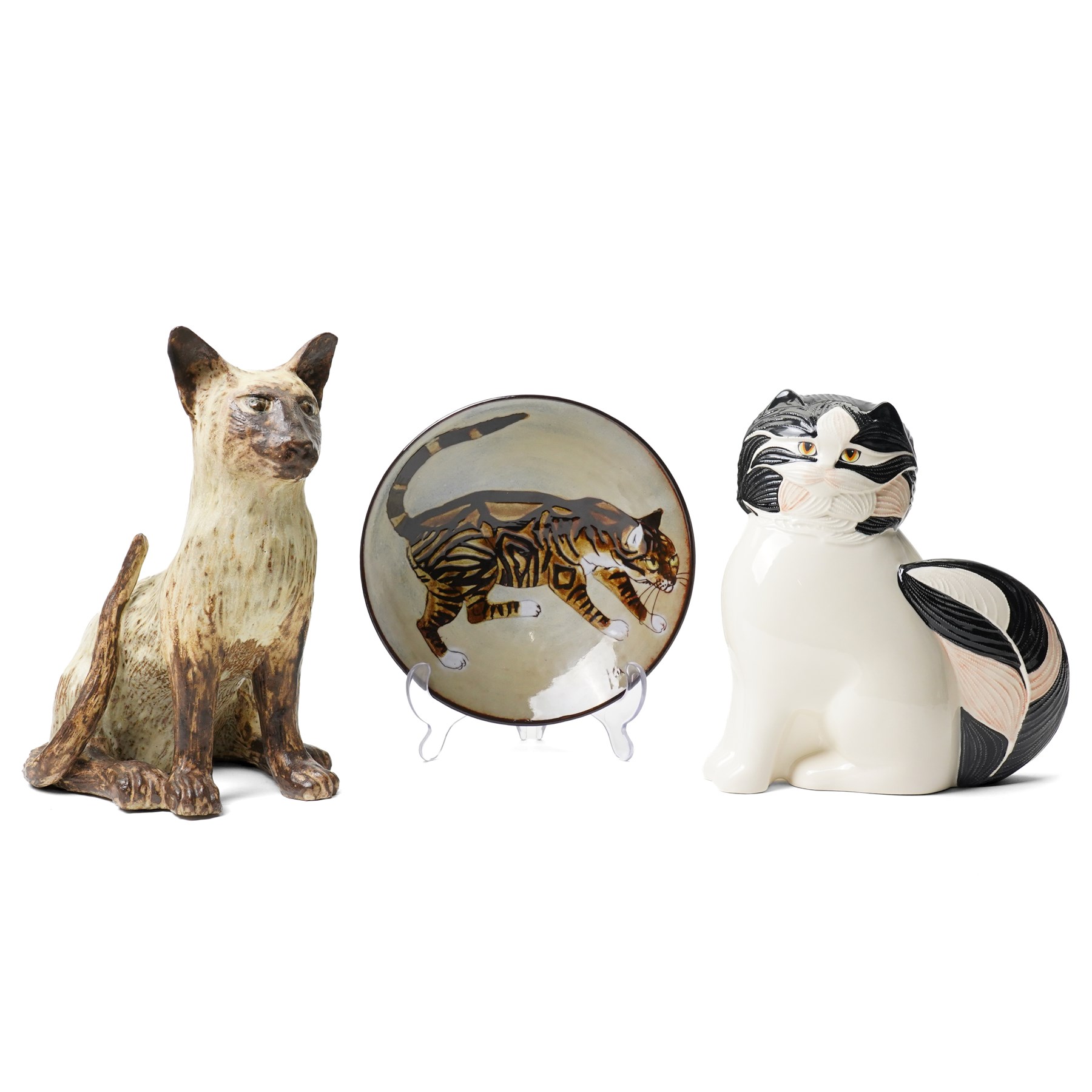 Joyce Morgan cat plate, signed to base, D21cm; George Selim for Goebel seated cat figure, H24cm, and a studio pottery figure of a Siamese, unsigned, H23cm (3)