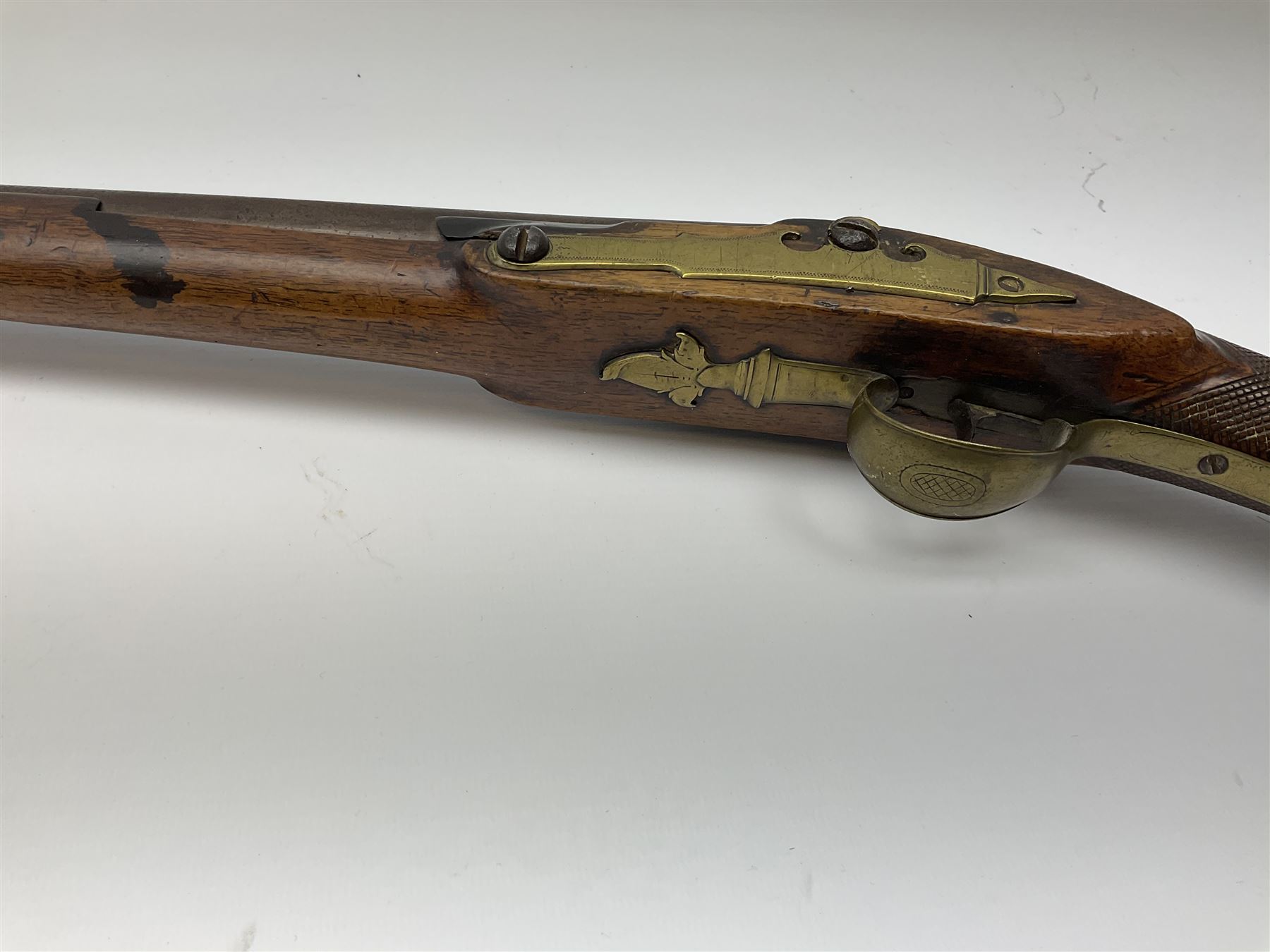Early 19th century 15-bore flintlock converted to percussion cap fowling piece, the lock stamped T. Richards, walnut half stock with brass fittings including trigger guard with pineapple finial and 91cm barrel with ramrod under L129cm overall