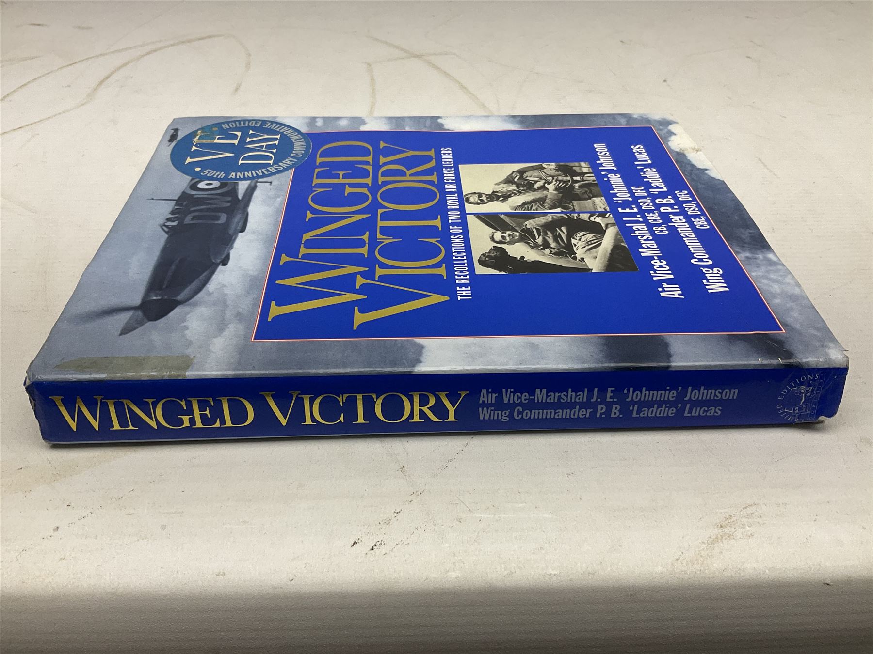 Winged Victory. 1995. Loose mounted signed dedication note and bookplate on the fep from the authors Wing Commander P.B. (Laddie) Lucas and Air Vice-Marshall J.E. (Johnnie) Johnson with duplicate signatures on the title page. Unclipped dustjacket.