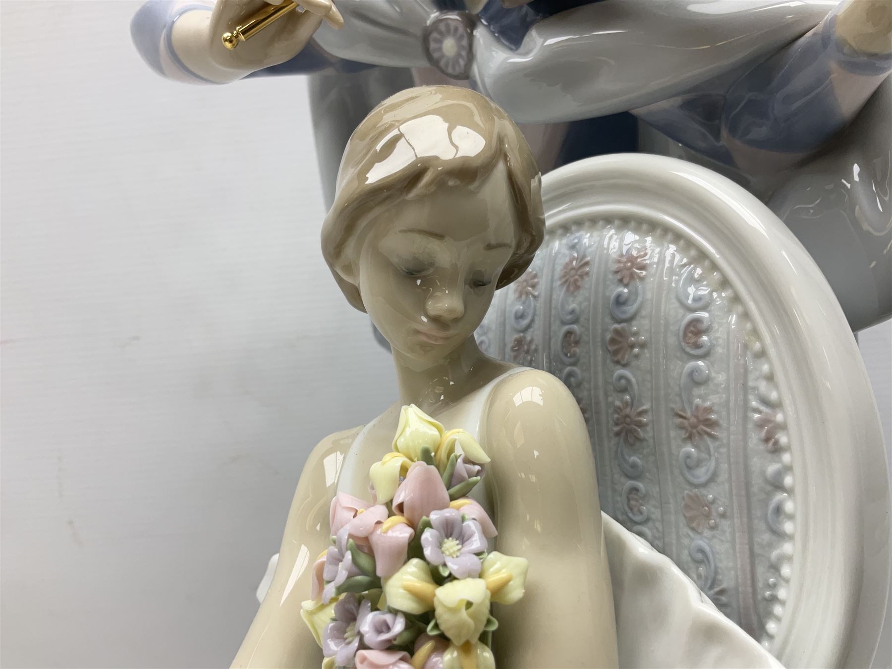 Lladro figure, Jester Serenade, modelled as a ballerina with bouquet of flowers seated before a jester playing the violin, limited edition 2541/3000, sculpted by Antonio Ramos, no 5932, with original box, year issued 1993, year retired 1994, H37cm