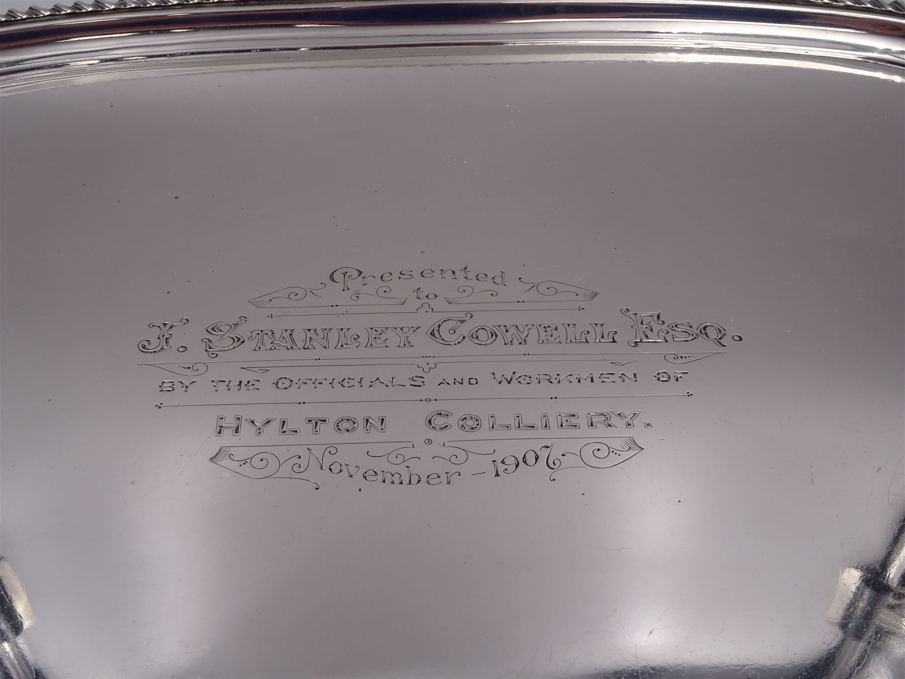 Edwardian silver twin handled tray, with oblique gadrooned rim and presentation engraving to the centre, hallmarked James Dixon & Sons Ltd, Sheffield 1907, not including handles W46cm