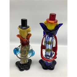Two Murano style glass clowns together with a ceramic jug