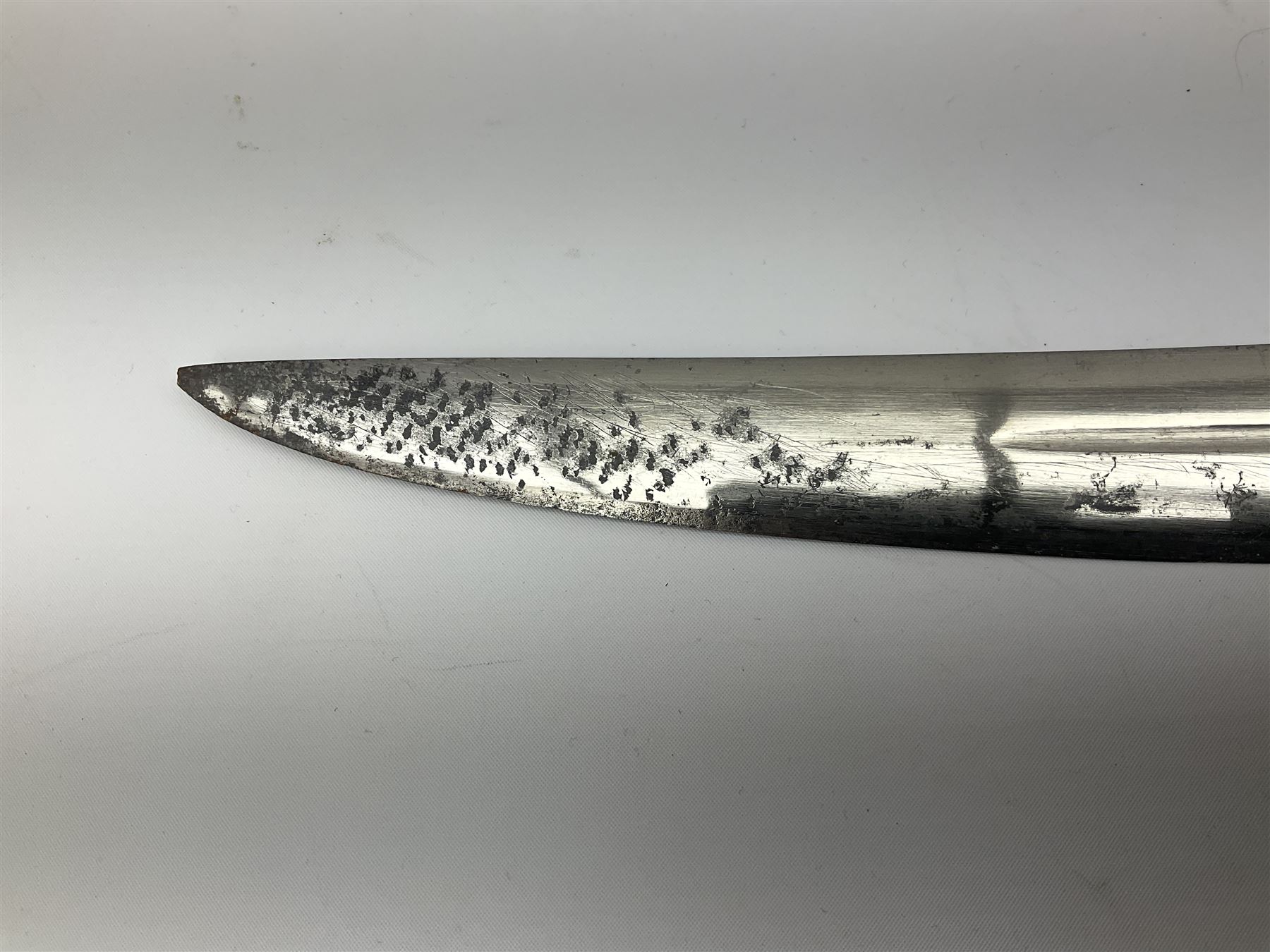 19th Century Indian Tulwar sword with 77cm single edged, slightly curved fullered blade;  steel crossguard, langets, grip and spiked disc pommel with stiff leaf decoration L90cm overall