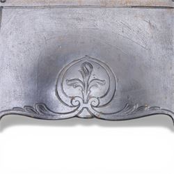 Art Nouveau cast iron fireplace, shaped hood with scrolling foliate crest, relief cast panel of female figure seated within shell form amidst wave motifs, uprights cast with foliate designs