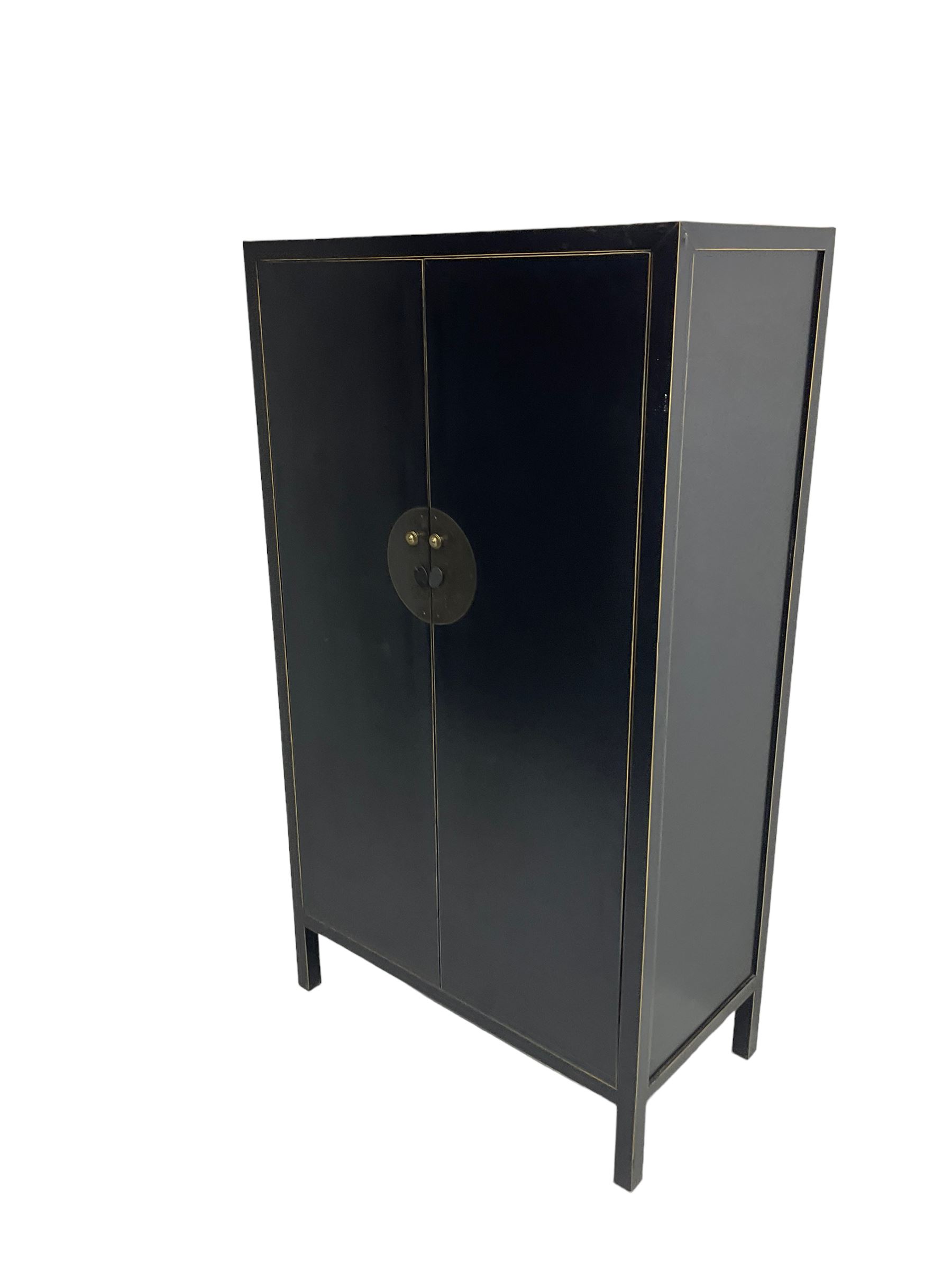 Chinese design black lacquered wardrobe, two cupboard doors enclosing hanging rail and two drawers