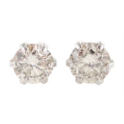 Pair of platinum round brilliant cut diamond stud earrings, stamped Pt 900, total diamond weight 0.30 carat