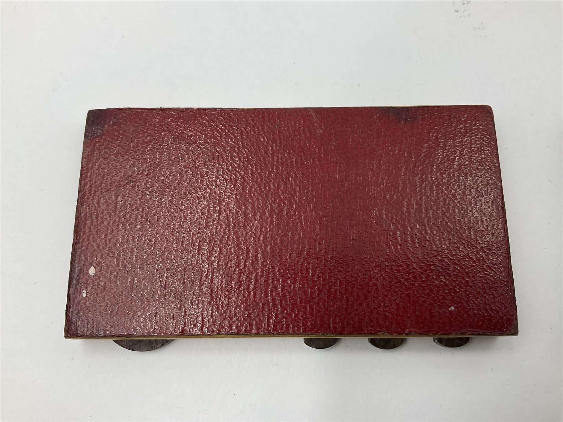 Edwardian silver mounted playing card case, hallmarked William Harrison Walter, Birmingham 1903, the sides each with a period playing card set behind a bevelled glass panel, the hinged cover with later engraving 'Presented to Norman T Crombie Esq by the officers & men of the 31st WR Detachment for services rendered 1917-1918', with red leather lined interior, the three compartments upon a sprung base and containing two later wooden Whist markers, case H12.5cm