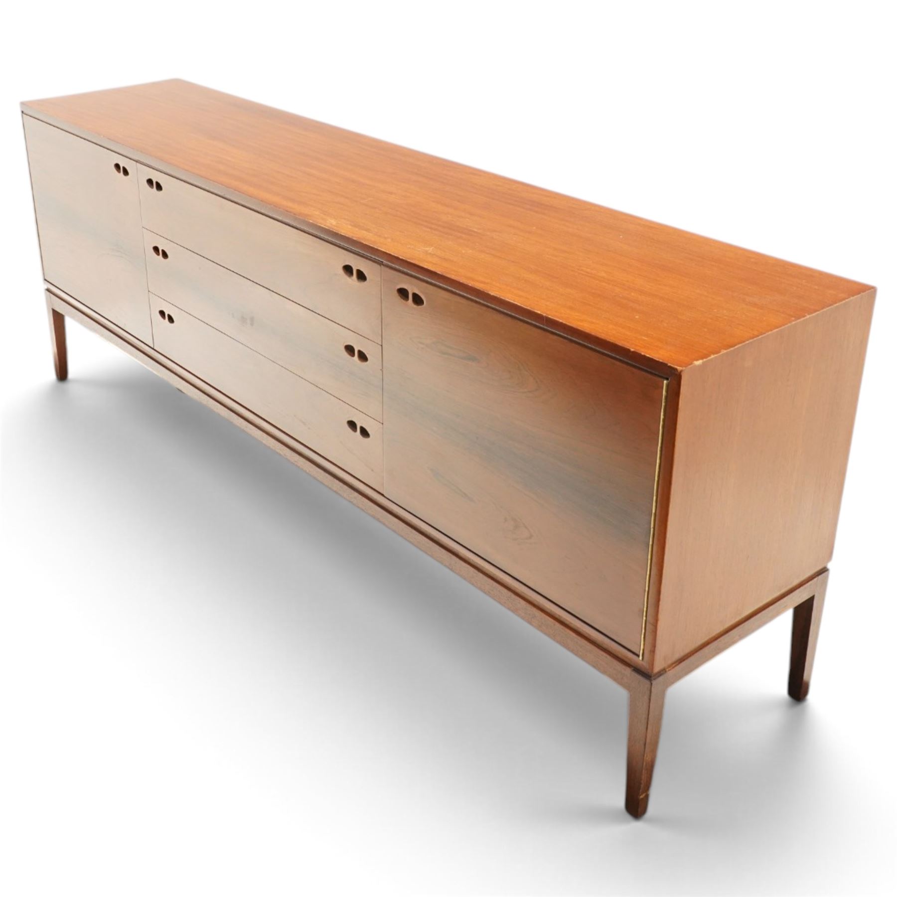 Robert Heritage (1927-2008) for Archie Shine - Large rosewood sideboard, with a central bank of three drawers flanked by a cupboard either side, raised on square tapering supports
