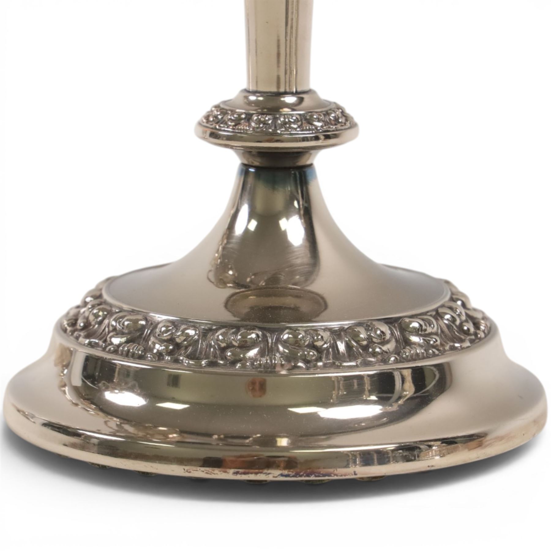 Silver plate two branch candelabra with grape vine decoration to the base, together with a matching pair of candle sticks and other candlesticks  