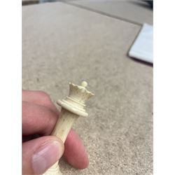 19th century walnut and brass bound games compendium box, painted to enhance the grain, of rectangular form, the hinged opening cover with rounded sides, central brass cartouche with engraved lion crest, and brass riveted straps, opening to reveal a red leather and blue silk lined compartmented interior, with fold-down games board, and lift-out tray containing playing cards, ebony turned dice towers, white and red stained bone draughts, and chess pieces, ivory dice, and ivory and ebony whist markers, and brass bezique board, cribbage board and markers, H15cm W32cm D24cm
This lot has been registered for sale under Section 10 of the APHA Ivory Act