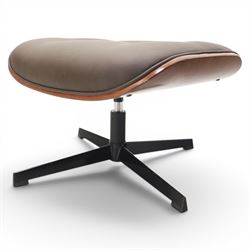 In the manner of Eames' Lounge chair, contemporary brown leather and plywood recliner and footstool, padded leather seat and arm rests, plywood backs raised on a black metal frames, reclines and swivels on a five point base  