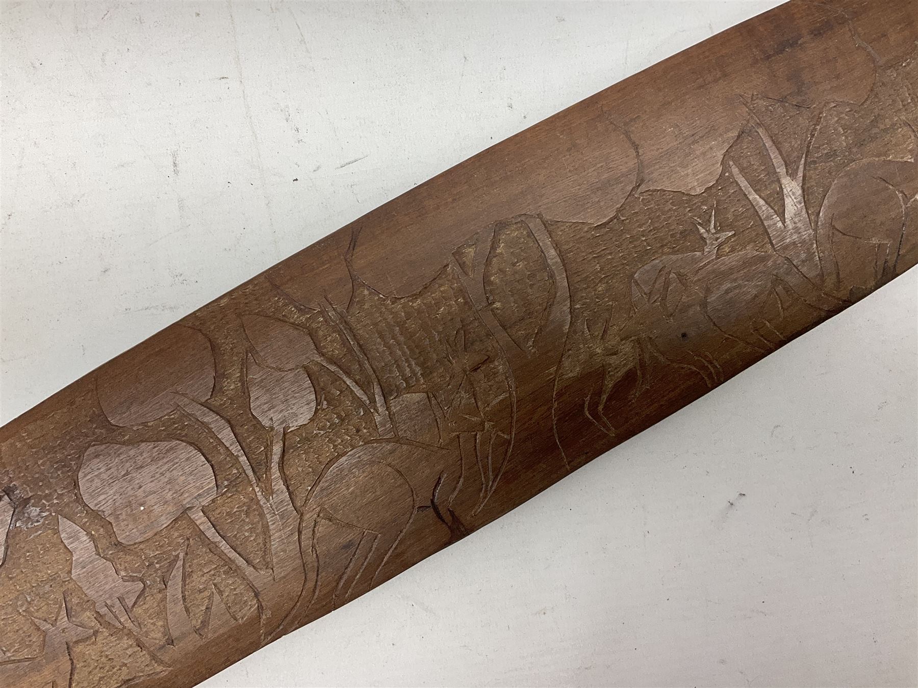 Australian Aboriginal shield, carved with Kangaroo and Emu, 74.5cm; Spear painted with aquatic creatures 78cm, and Spear thrower 81cm (3)