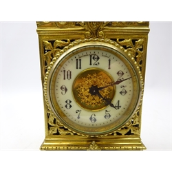  Late Victorian mantle clock with ornate cast and pierced brass case, the circular dial with Arabic numerals inscribed Fattorini & Sons, Bradford with eight day movement, H27cm   