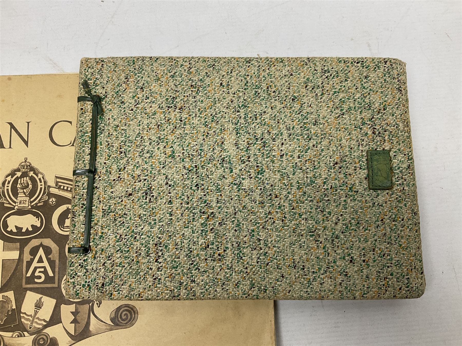 Modern album containing over sixty postcards and photographs including memorial portraits of KIA soldiers, regimental crests, comic, WW1 embroidered silk, uniforms, cap badges, camp and manoeuvre images etc; another personal photograph album of WW2 soldiers relaxing; Royal Armoured Corps booklet 'The Italian Campaign 3rd Sep. 1943 - 2nd May 1945; and other paper ephemera of military interest