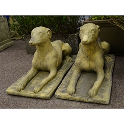  Pair composite stone recumbent dogs, L72cm  