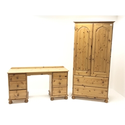  Pine double wardrobe, two doors above two drawers, bun feet (W94cm, H190cm, D57cm) and matching kneehole dressing table, six drawers, bun feet (W143cm, H78cm, D46cm) (2)  