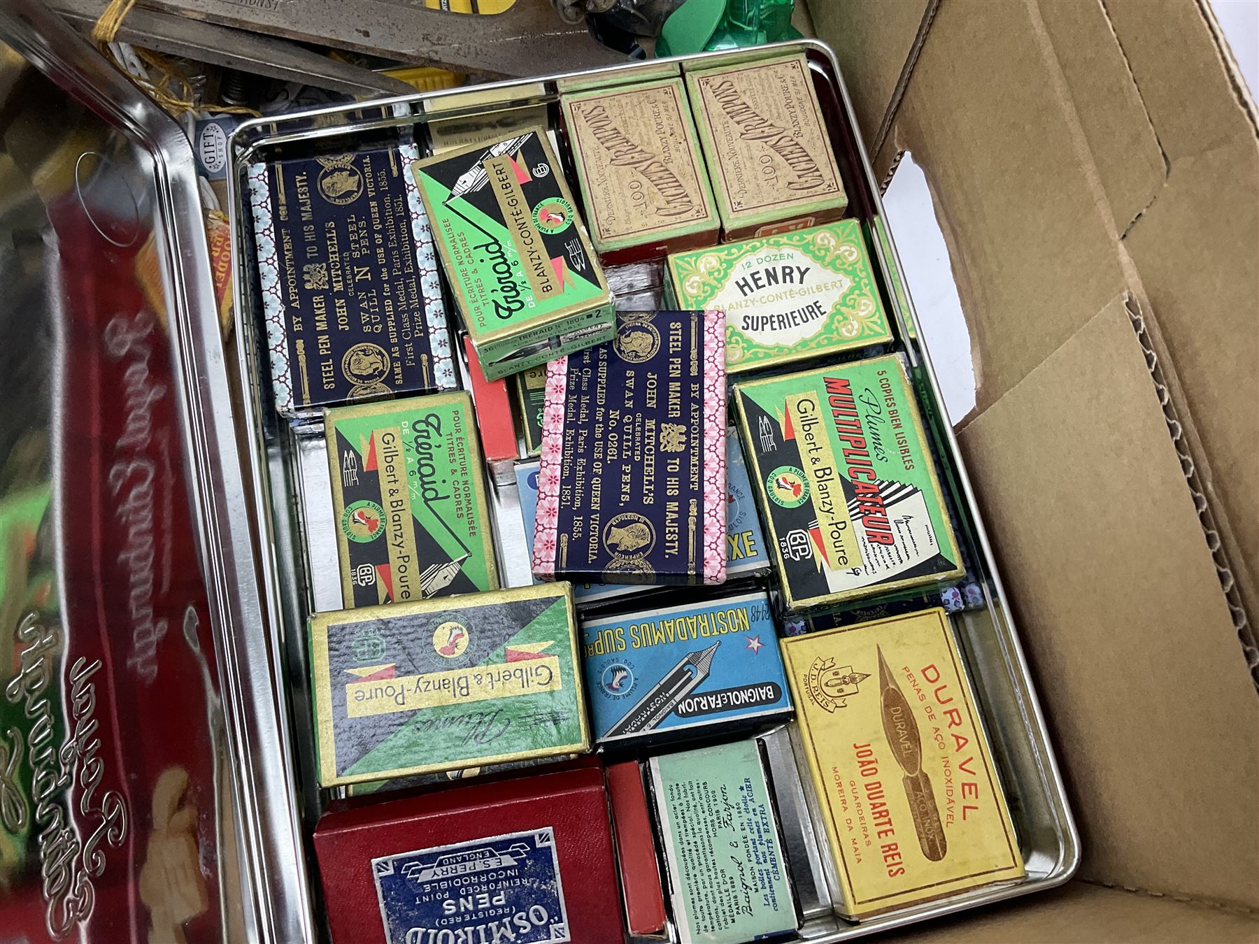 Daiwa 7700A fishing real, together with ice skate blades, pen nibs and other collectables 