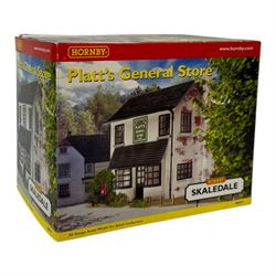 Ten Hornby '00' gauge Skaledale buildings, comprising R9834 Village Tea Rooms, R8506 Brambles Cottage, R8507 Platt's General Store, R8503 St Michaels School, R9769 The Pine Shop, R8641 Platform Footbridge, R8639 Water Tower, R8587 Coal Stage, R8589 Level Crossing Signal Box and R8638 Platform Shelter, all boxed
