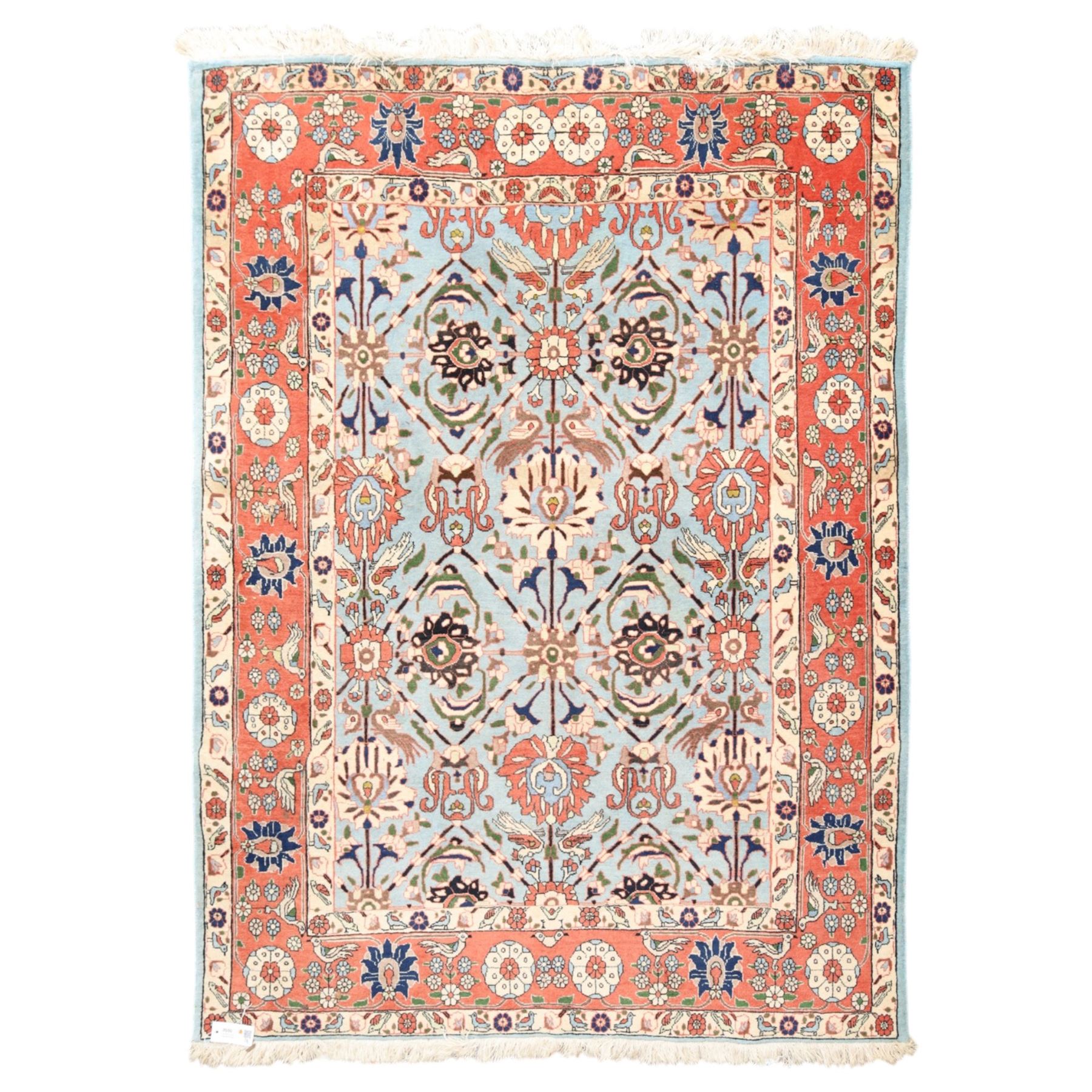 Persian Tabriz cyan ground rug of Benlian design, the field decorated with large palmette motifs, the crimson and ivory guard lines with repeating bird of paradise and interspersed stylised plant motifs