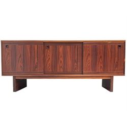 NH Chapman & Co Siesta - mid-20th century sideboard, fitted with three sliding doors, enclosing two drawers and shelves, raised on twin end supports