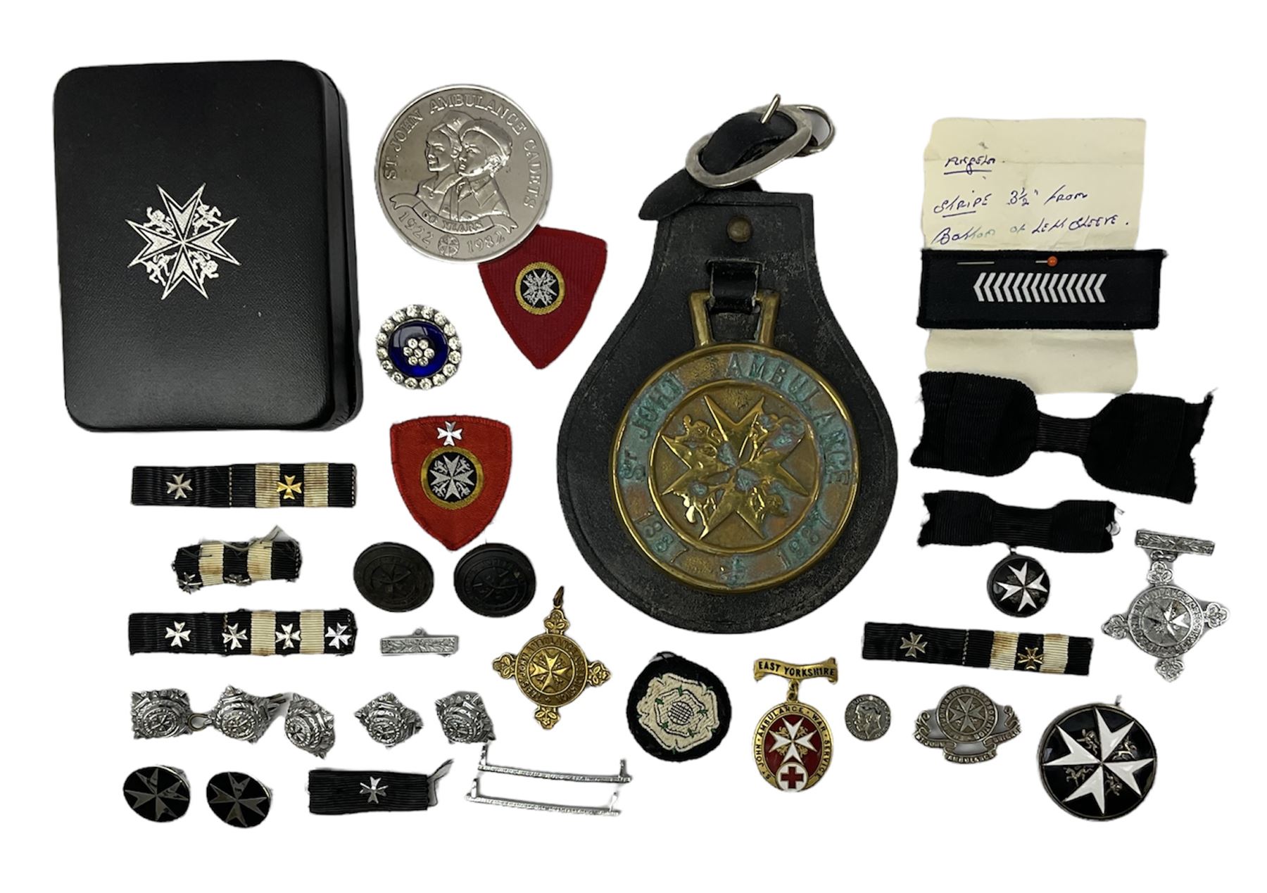 Collection of St John Ambulance enamel, metal and embroidered badges, together with St John Ambulance cadets sixty years medallion and a horse brass  