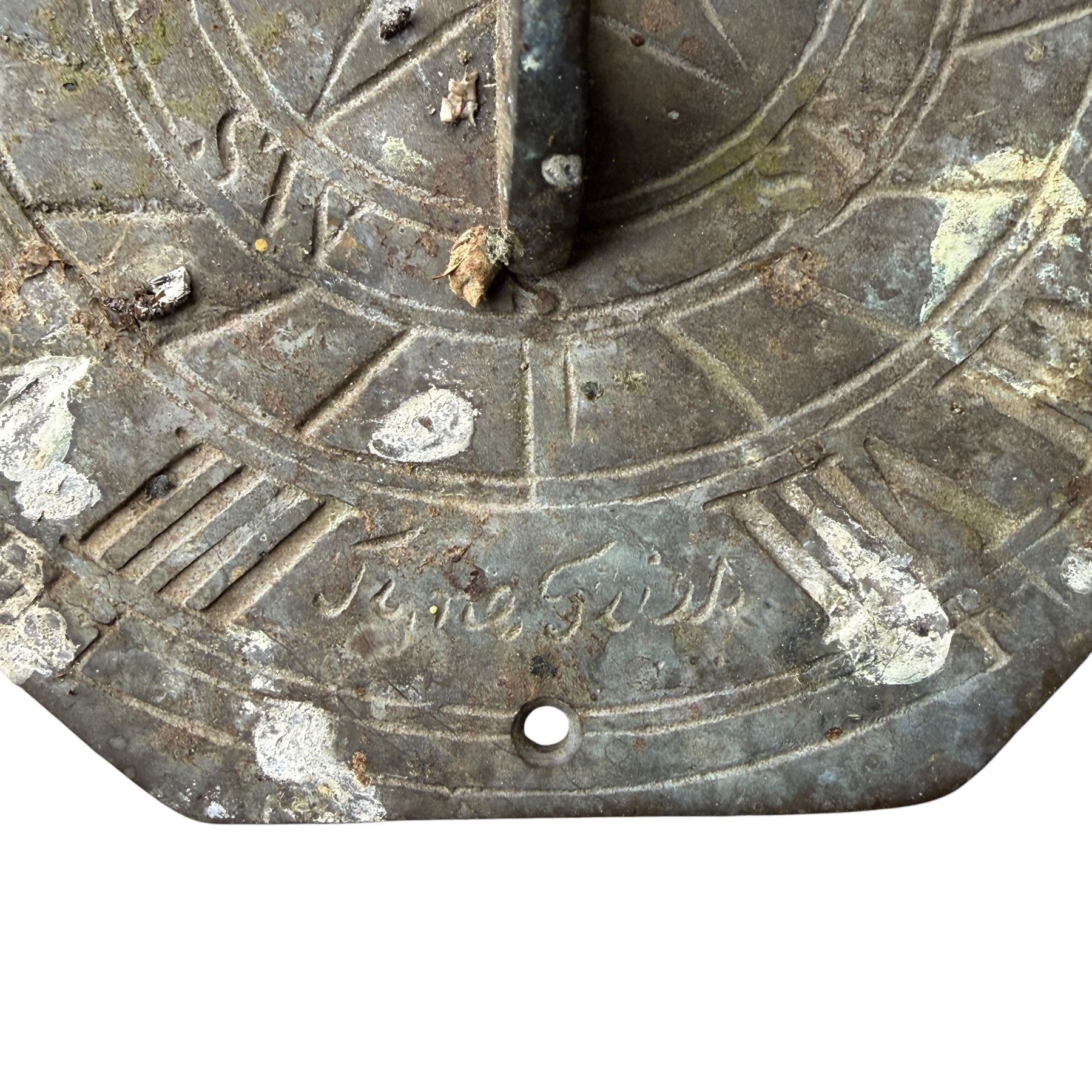 Weathered cast stone sundial on fluted pedestal