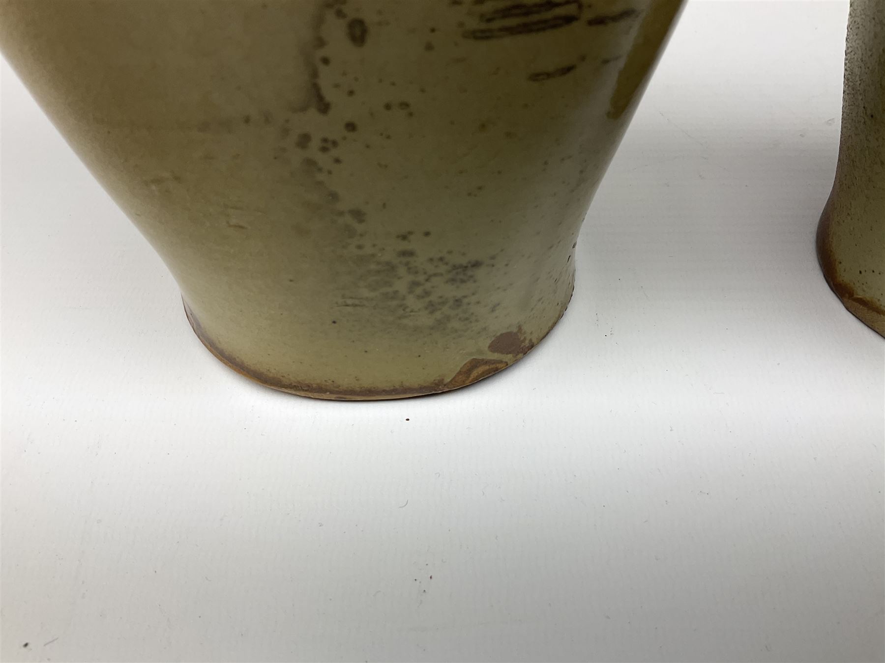  19th century salt glazed stoneware gin bottle impressed John Shaw, Red Lion Vaults, Whitefriargate, Hull of bulbous oval form H27cm and another with impressed label for J. Christie Mytongate Hull (2)  