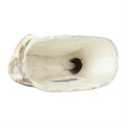 Late 18th/early 19th century Staffordshire model of a fox, the stalking fox decorated in Pratt type colours upon a green grassy mound base detailed with blue and ochre flowers, bearing Jonathan Horne labels beneath, H5.5cm L9cm

