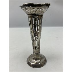 20th century silver specimen vase, of pierced trumpet form with flared rim, filled base, and blue glass liner, hallmarked Birmingham 