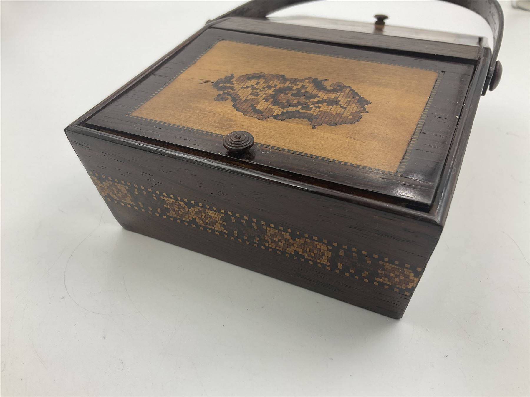 19th century rosewood Tunbridge Ware basket, of rectangular form with curved bentwood handle, and twin hinged sloping covers, lifting to reveal paper lined interiors, not including handle H5.5cm D10.5cm L18cm