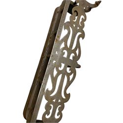 Victorian steel fire fender, the shaped open fretwork top in a scrolled design, raised on turned spindle supports, the base decorated with applied steel detail