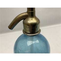 Two blue glass soda syphons, the first example marked 'Jewsbury & Brown Ltd Manchester', the second marked 'Sodas L.Gourdon Rennes', largest H31cm