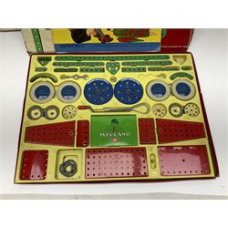 Meccano - Outfits 4, 6 & 7 with red and green parts; Outfits 4 & 6 virtually fully stocked and Outfit 7 containing large quantity of loose parts; Outfits 4 & 7 with instruction manuals; all boxed (3)
