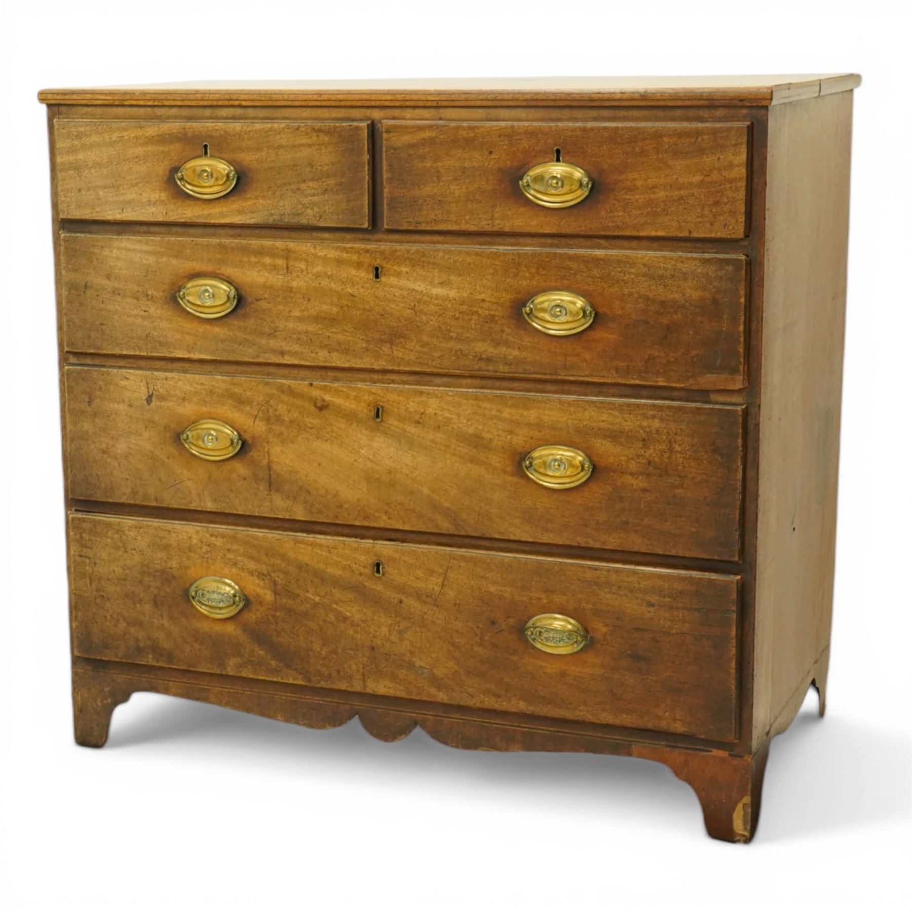 George III mahogany straight-front chest, fitted with two short over three long graduating drawers, each fitted with original pressed brass handle plates, shaped apron over bracket feet