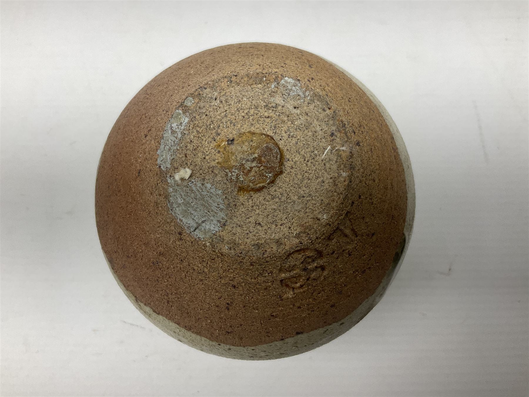 Janet Leach (American, 1918-1997) for Leach Pottery; speckled studio pottery vase of shouldered ovoid form with speckled brown decoration and trailing green and brown glaze upon beige and brown ground, with impressed J.L. monogram and Leach Pottery mark beneath, together with a Jeremy Leach blue speckled lidded circular dish with loop handle, impressed J.L, tallest H11cm