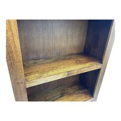 Contemporary Dakota mango wood open bookcase, rectangular form with four fixed open shelves, raised on stile supports