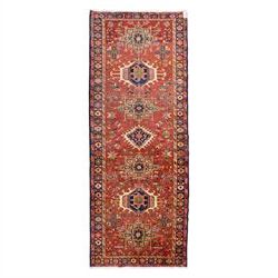 North West Persian Karajeh hand-knotted runner, madder red field, decorated with a vertica...