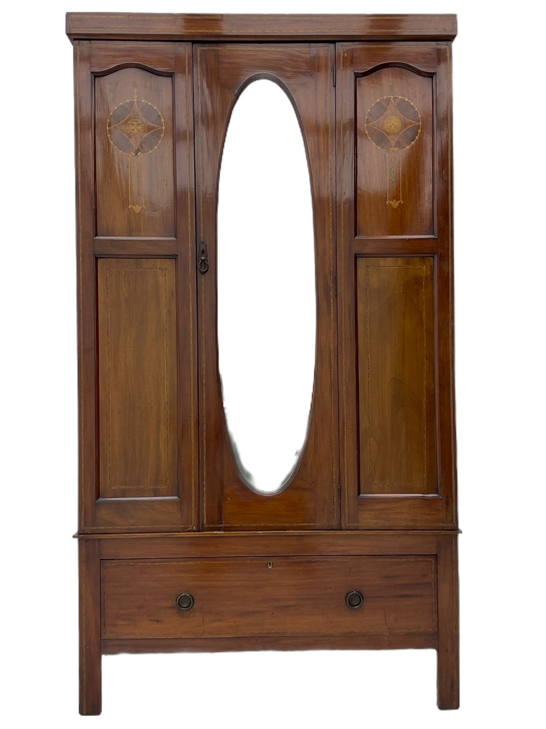 Edwardian inlaid mahogany wardrobe, oval mirror door, single drawer to base