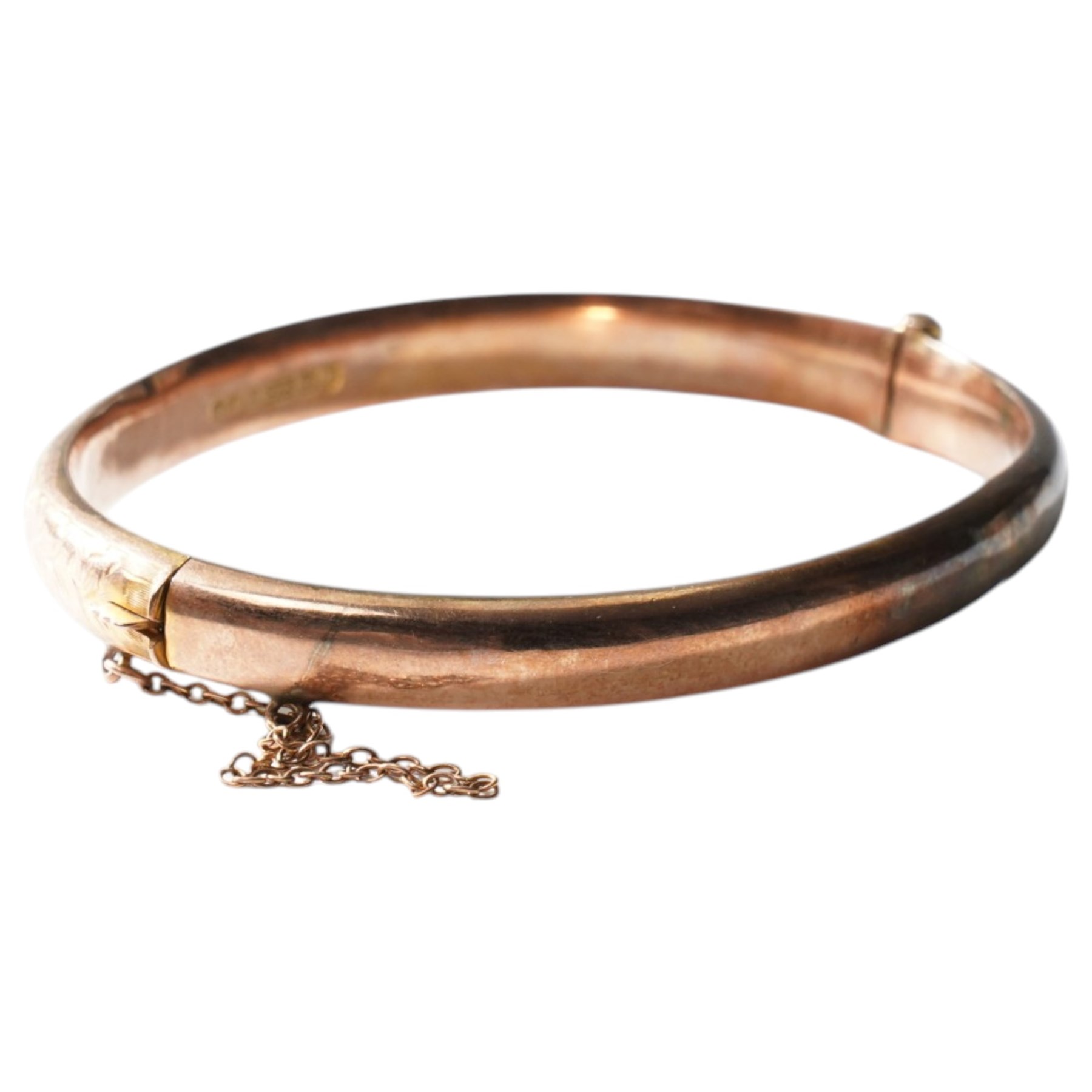 9ct gold hinged bangle with engraved decoration 