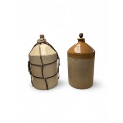 Two large stoneware flaggons, onemarked C&E LTD Southampton, both with cork/wooden stoppers, H58cm